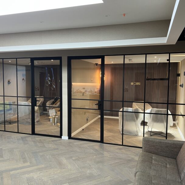 Black banded glass partitions in a new office fit out designed and installed by MFE Glass Partitioning